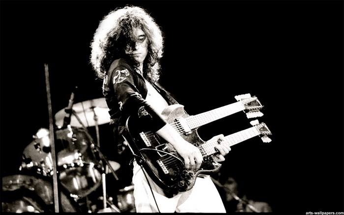 Jimmy Page of Led Zeppelin playing a double-neck guitar