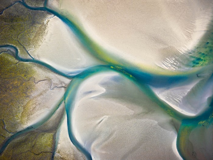 Aerial view of river delta with turquoise water and sandbanks