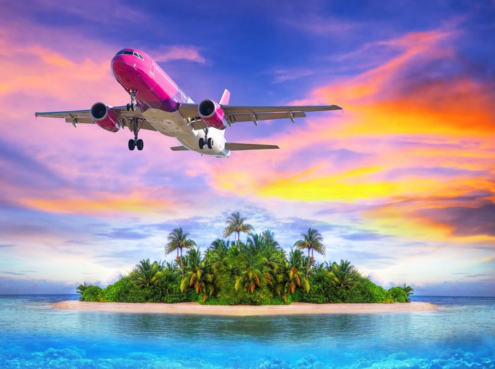Airbus A320 Flying Over Tropical Island at Sunset