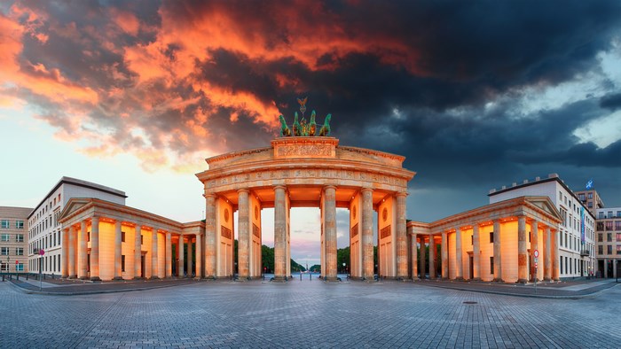 Brandenburg Gate at sunset with dramatic clouds