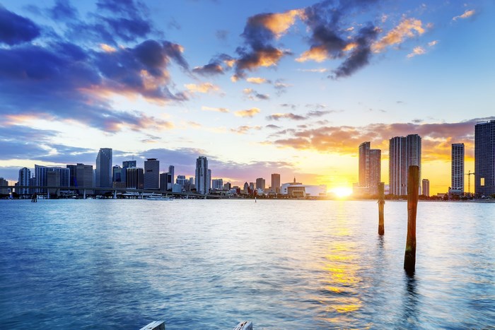 Miami skyline at sunset over the water
