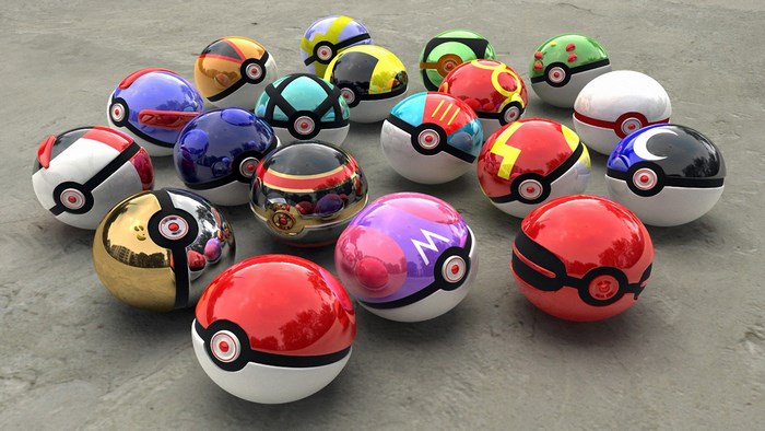 Collection of various Pokemon balls on a concrete surface