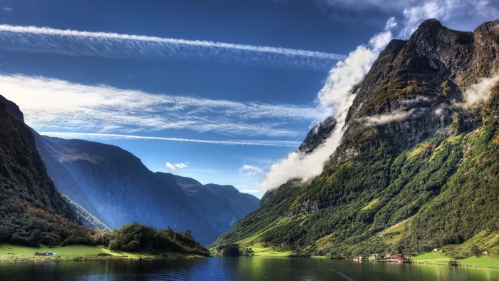 Fjord with mountains and clouds