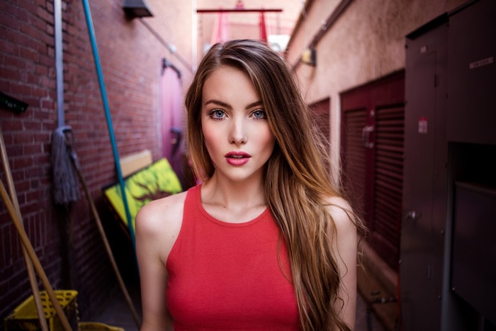 Young Woman with Long Hair in Alleyway