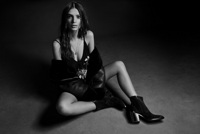 Emily Ratajkowski in black dress and boots