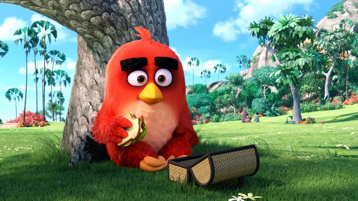 Red from Angry Birds eating a sandwich