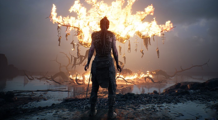 Senua from Hellblade Sacrifice in front of a fire
