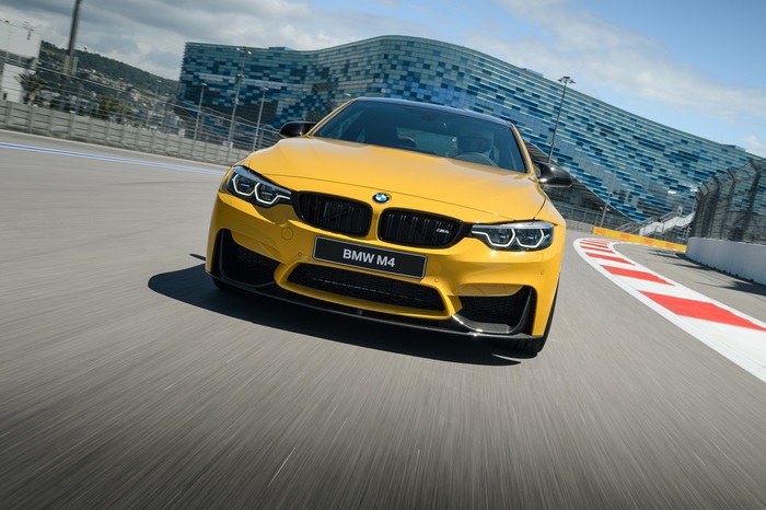 Yellow BMW M4 Competition on a Race Track 4K
