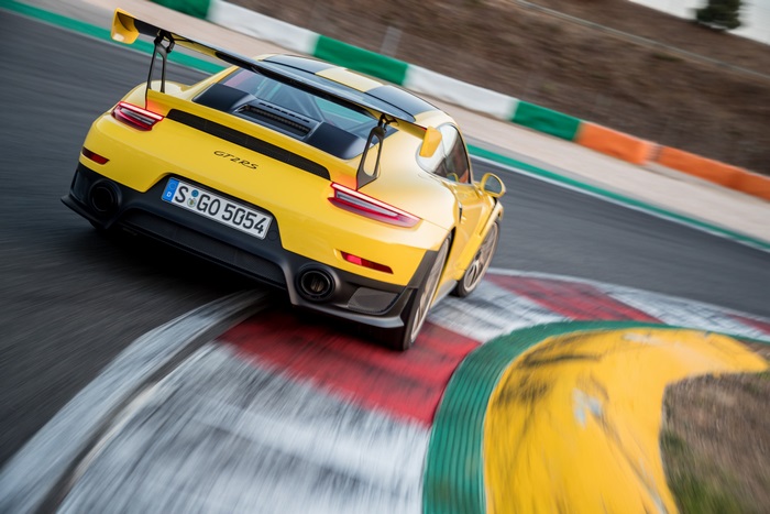 Yellow Porsche GT2 RS on a Race Track