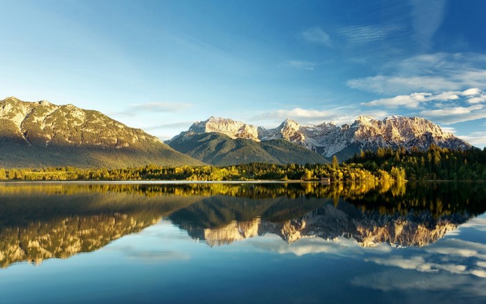 Mountain Range Reflected on Calm Lake in Canada