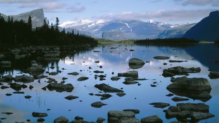 Lake with rocks and mountains in Sarek National Park, Sweden