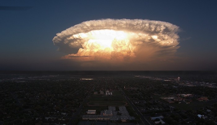 Supercell storm cloud over a Texas cityscape at dusk