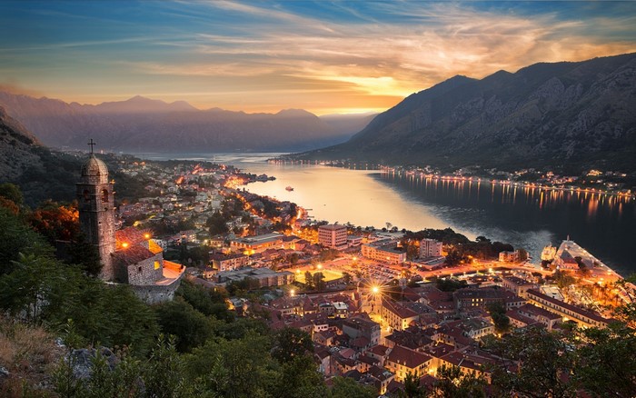 Kotor town at sunset with mountains and bay