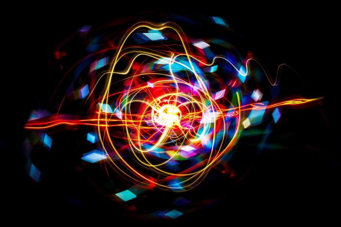 Abstract light painting with colorful diamonds and waves