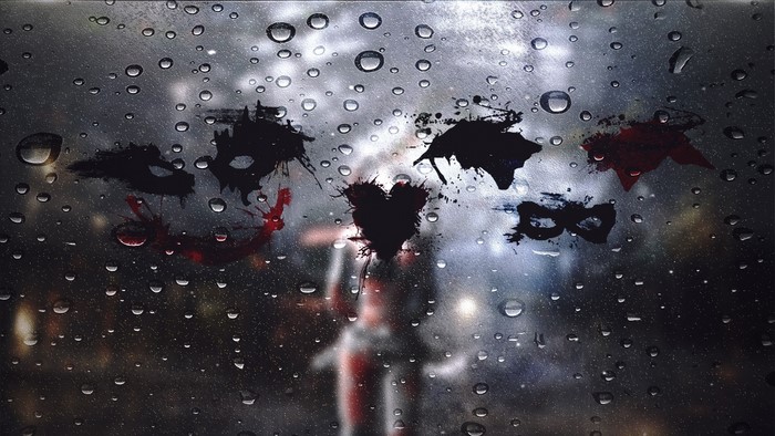 Joker, Harley Quinn, and Batman masks on a rainy window