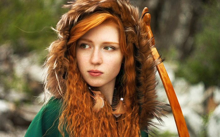 Redhead woman with bow and fur hood