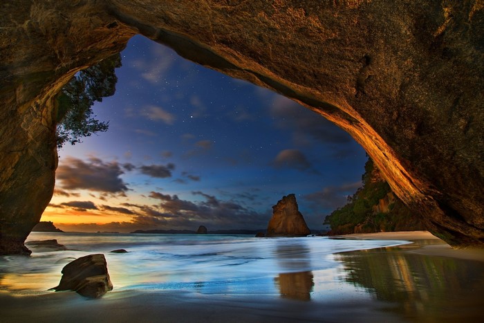 Sunset View from a Cave Overlooking Beach and Sea