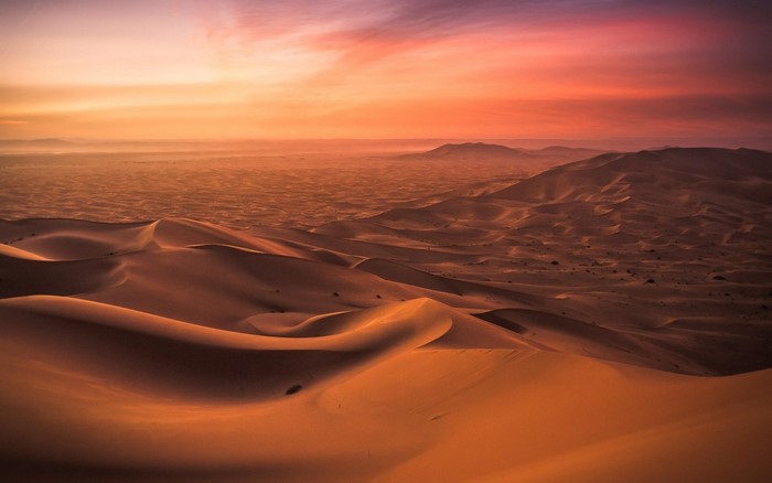 Sunset over Rolling Desert Dunes in Morocco