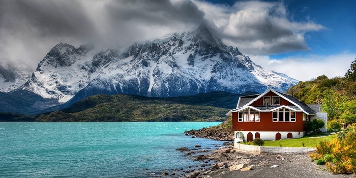 Snowy Mountain Lake House with Turquoise Water in Chile
