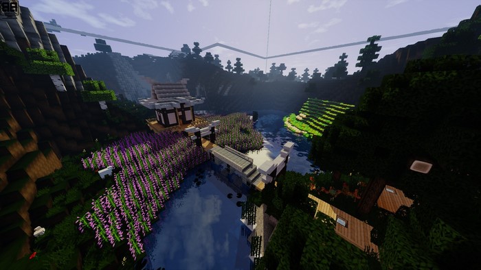Minecraft landscape with Japanese-style buildings and a river