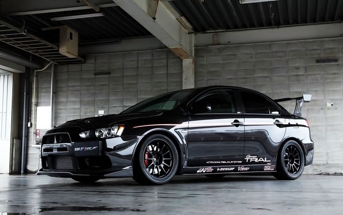 Black Mitsubishi Lancer Evolution X with racing modifications