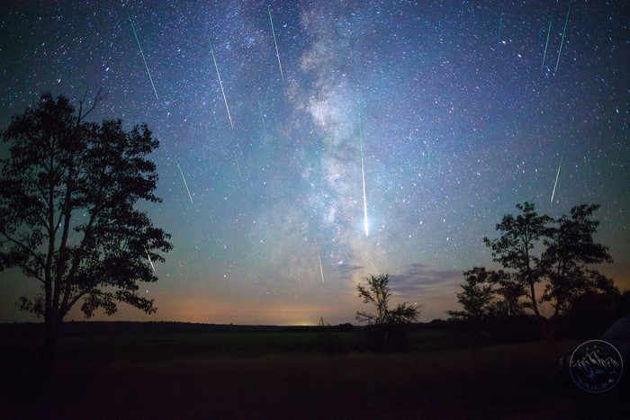 Milky Way and meteor shower over landscape