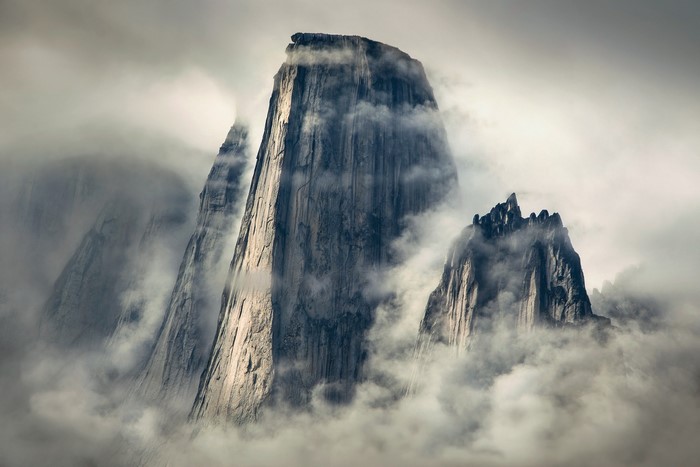 Misty mountains in Greenland with sunlight