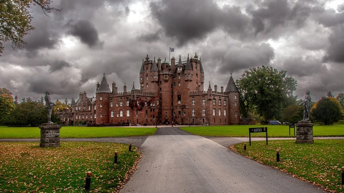 Historic Glamis Castle in Scotland with Clouds