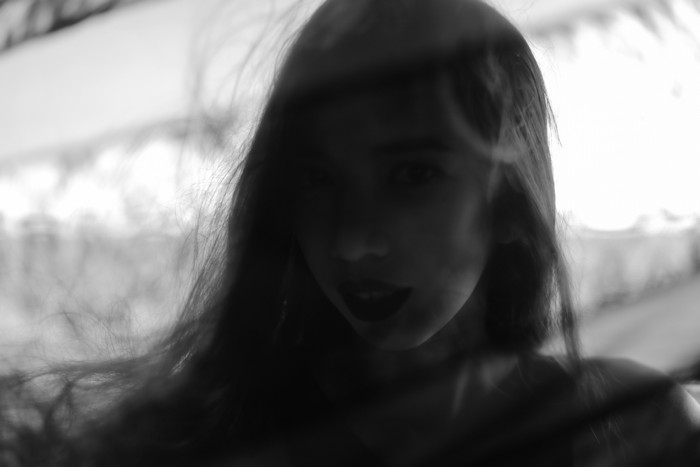 Monochrome portrait of a woman with dark lipstick