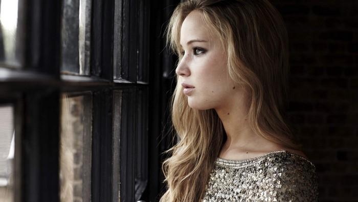 Jennifer Lawrence looking out a window