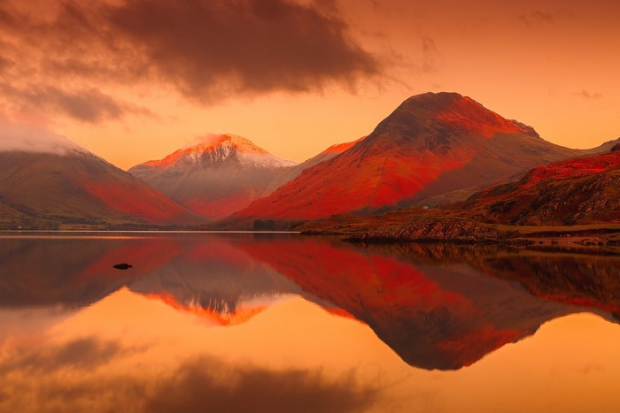 Lake District mountains reflecting in a lake at sunset