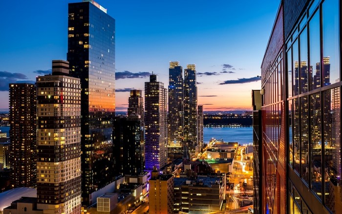 New York City skyscrapers at sunset over the river