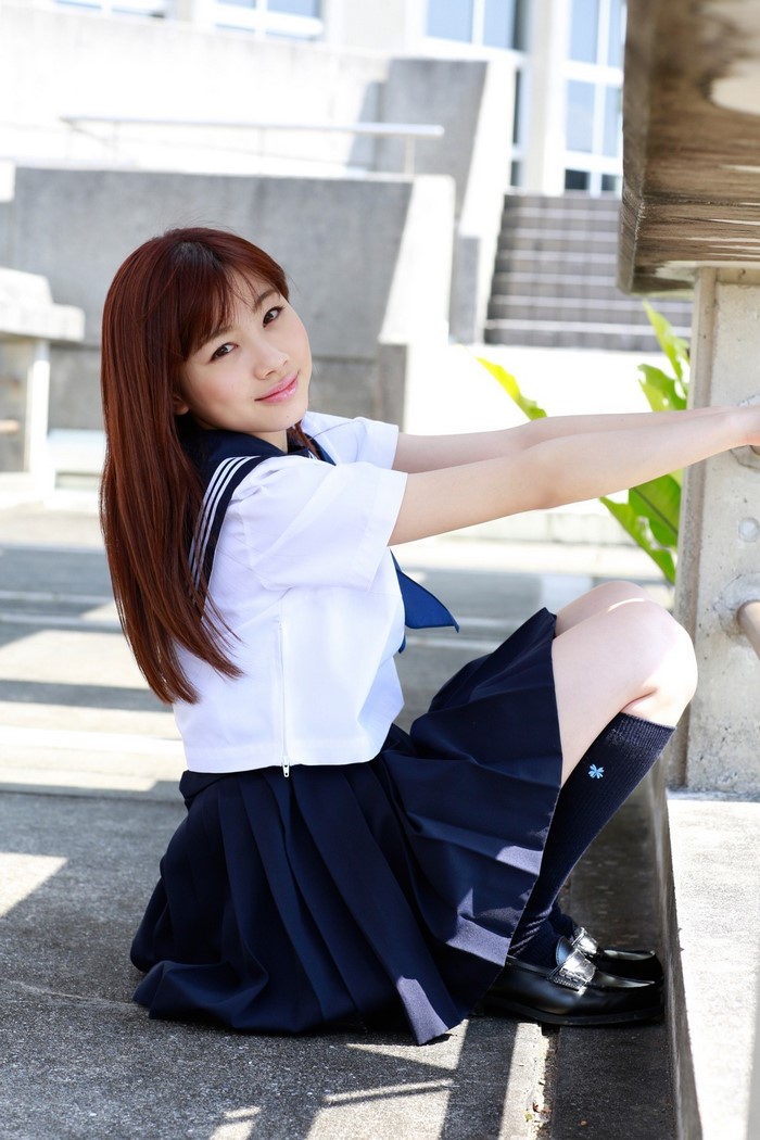 Asian girl in school uniform outdoors