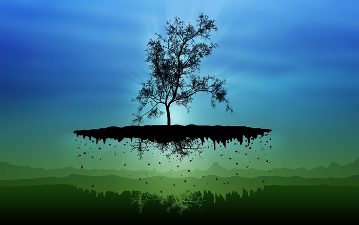 Silhouette of a tree on a floating island