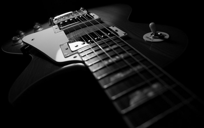 Close-up of a dark electric guitar