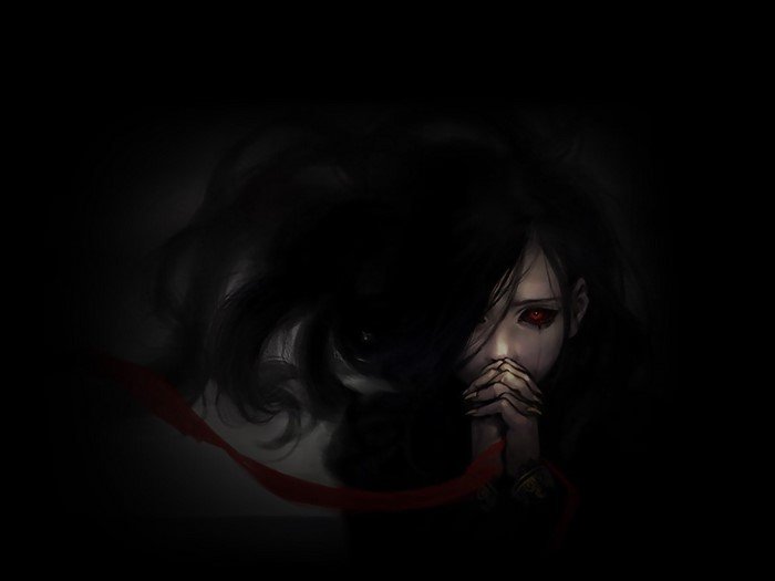 Gothic girl with red eyes praying in darkness