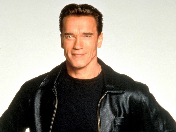 Arnold Schwarzenegger in a black leather jacket