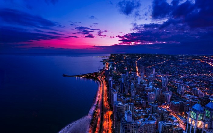 Chicago cityscape at night by the sea