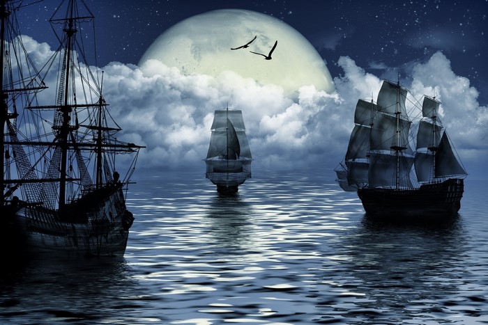 Fantasy sailing ships under a large moon