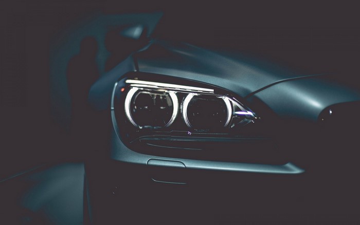 BMW headlights closeup dark