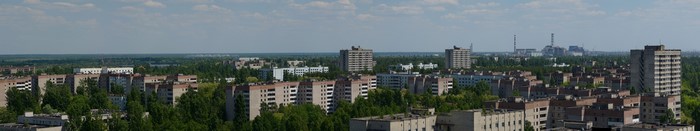 Pripyat panorama with Chernobyl power plant in distance