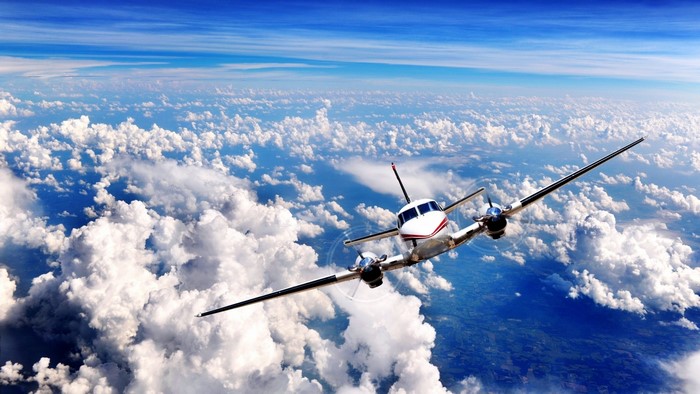King Air C90 Airplane Flying Above Clouds