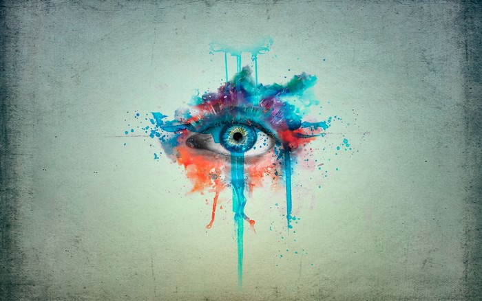 Eye with colorful paint splatter and grunge texture