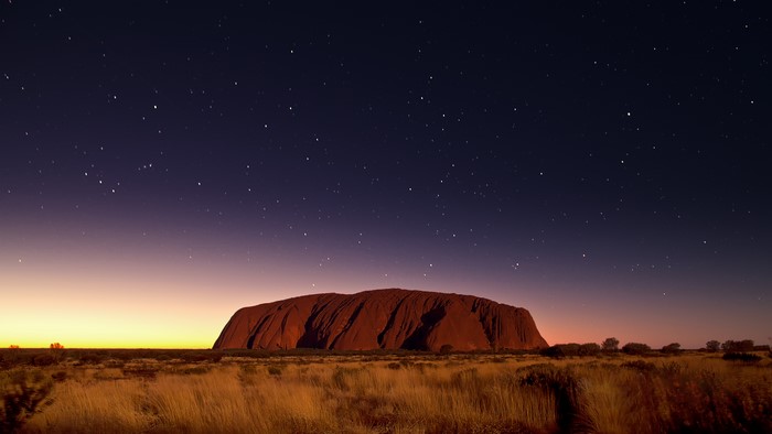 Uluru at twilight with stars