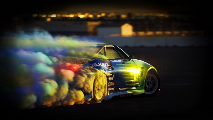 Blue Car Drifting with Smoke Trail at Night