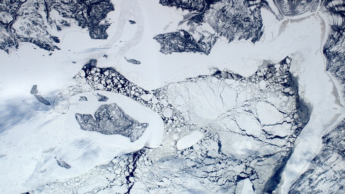 Aerial view of ice floes and mountains