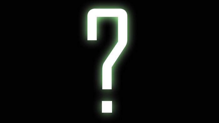 Glowing question mark on black background