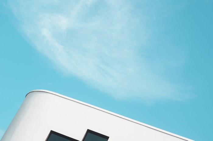 Minimalist architecture against a clear blue sky