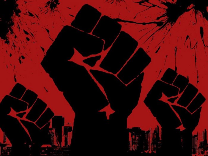 Three raised fists against a red background with city skyline