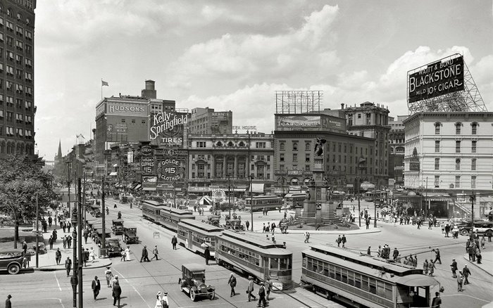 Vintage Detroit Street Scene with Trams and Advertisements